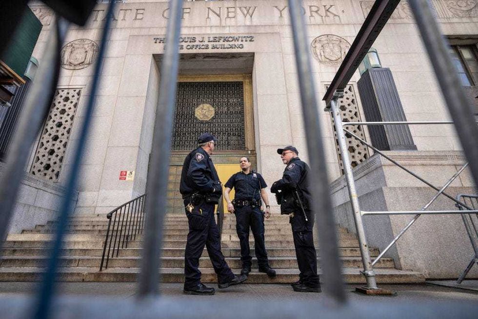 Court security personnel stand outside the Louis J. Lefkowitz State Office Building on March 27, 2023 in New York City.