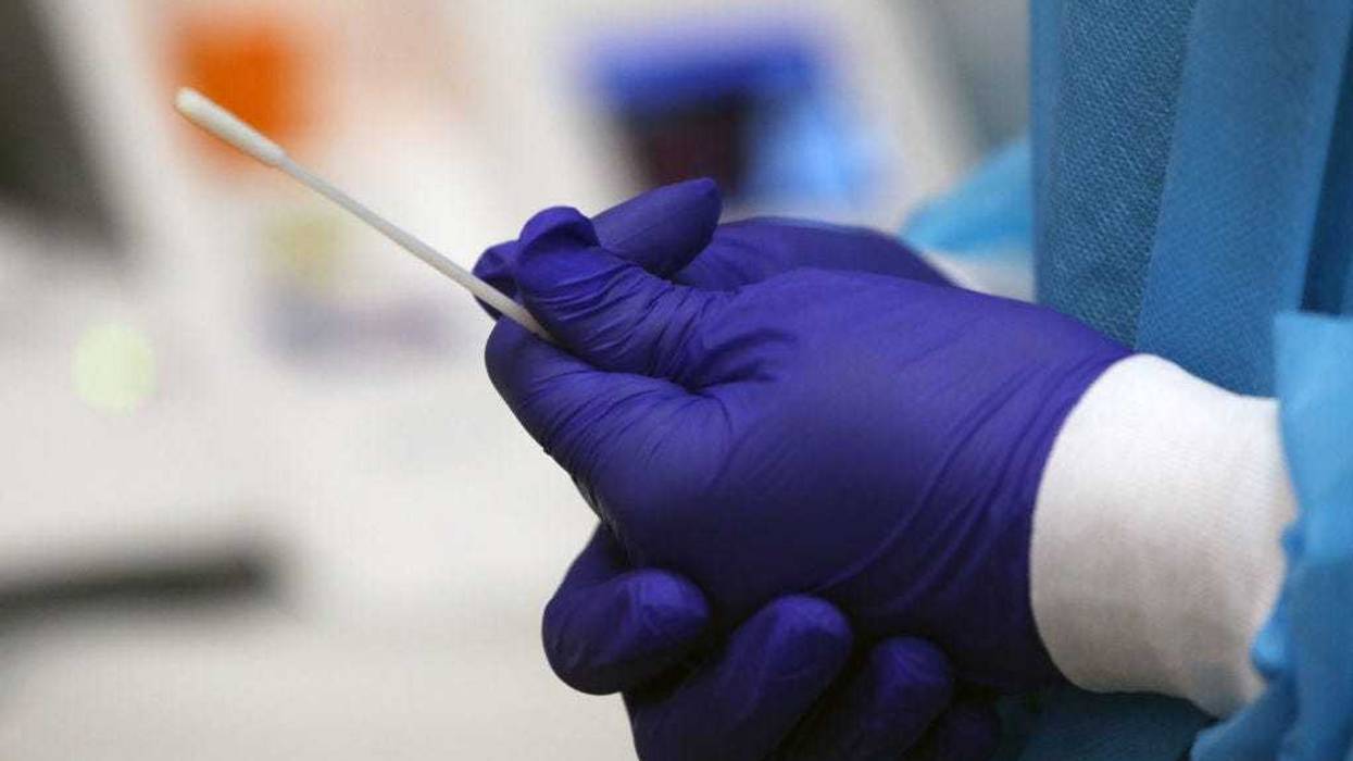 COVID rapid test swab/Getty Images