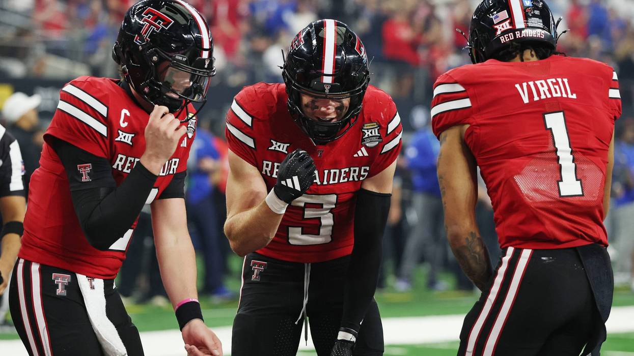Coy Eakin #3 of the Texas Tech Red Raiders celebrates with Behren Morton #2 and Reggie Virgil #1 after scoring a receiving touchdown against the BYU Cougars during the fourth quarter in the 2025 Edward Jones Big 12 Championship at AT&T Stadium on Dec. 6, 2025 in Arlington, Texas.