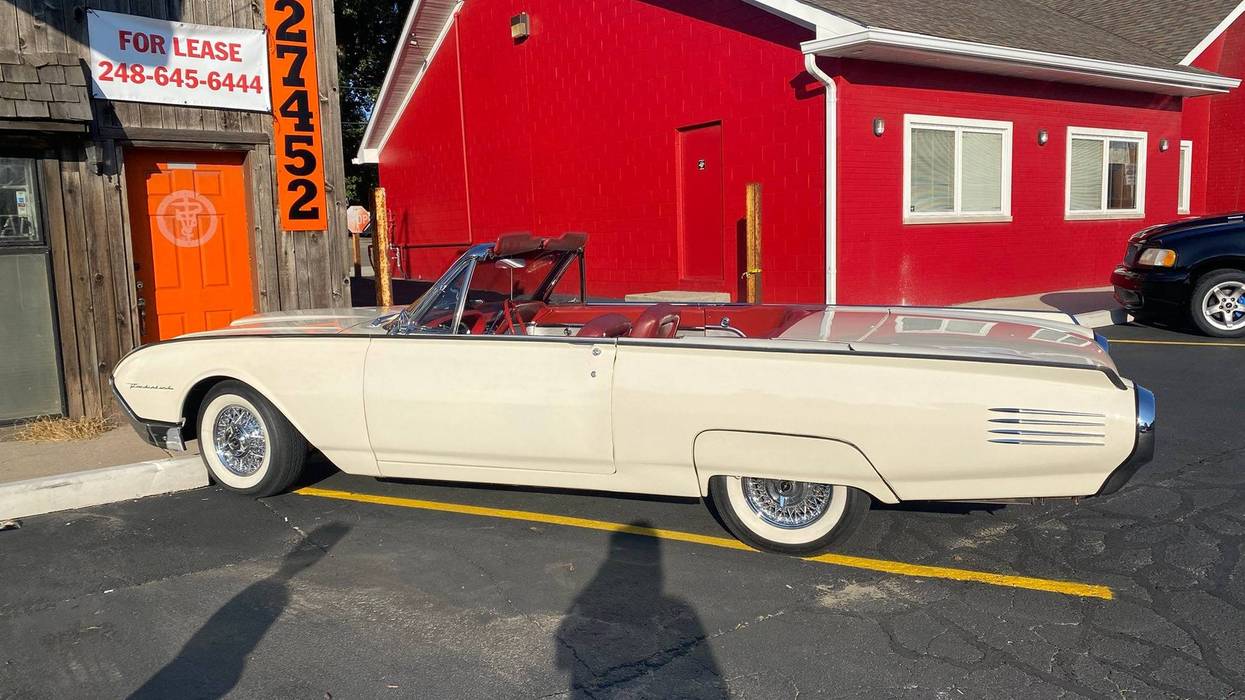 Cream colored Ford Thunderbird parked at Woodward Dream Cruise