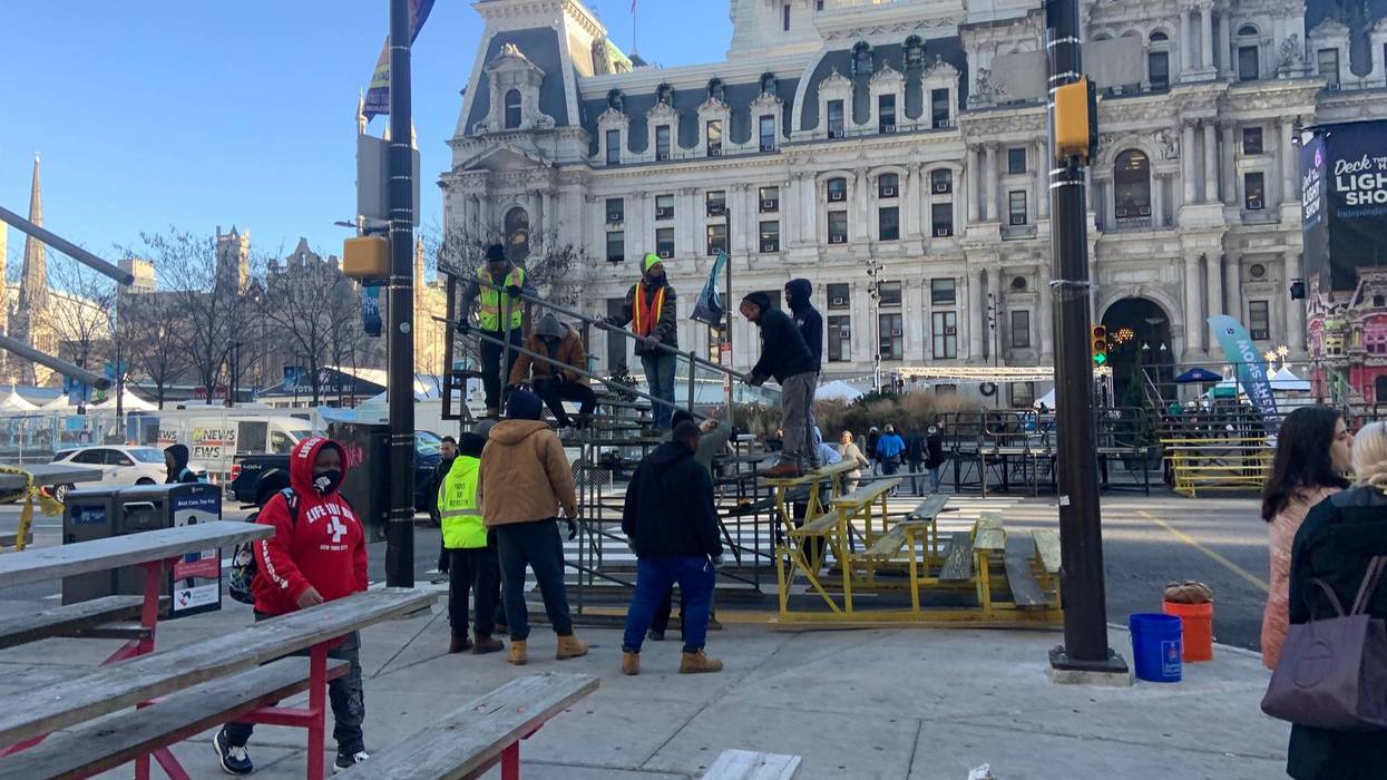 Crew set up bleachers outside City Hall on Friday.