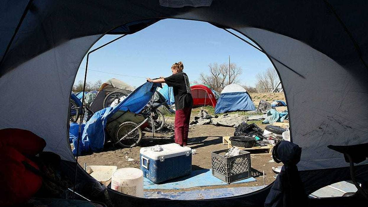 Crews are clearing a homeless camp that settled on Apple property in North San Jose.