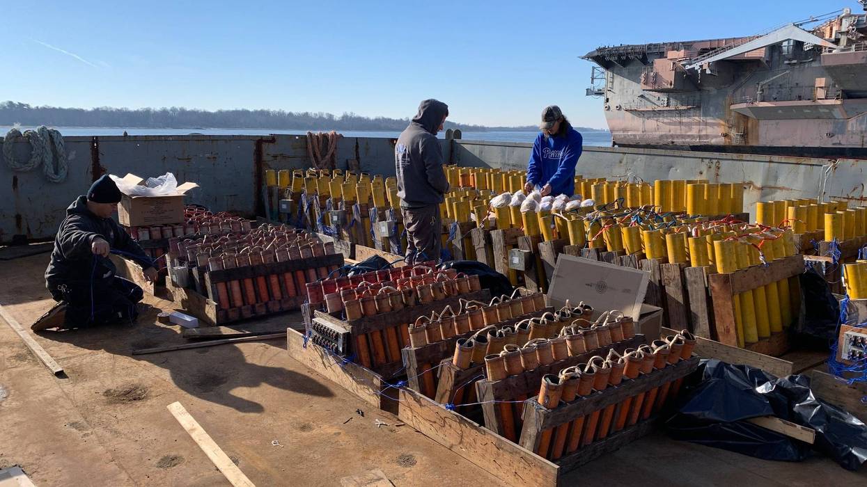 Crews at the Navy Yard on Dec. 29, 2022, set up the mortars and connect the wires from the explosives to the computer that will set them off, all ahead of two 12-minute fireworks shows at Penn's Landing.