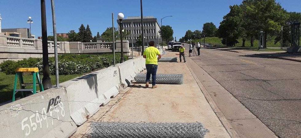 Crews at work on capitol fence