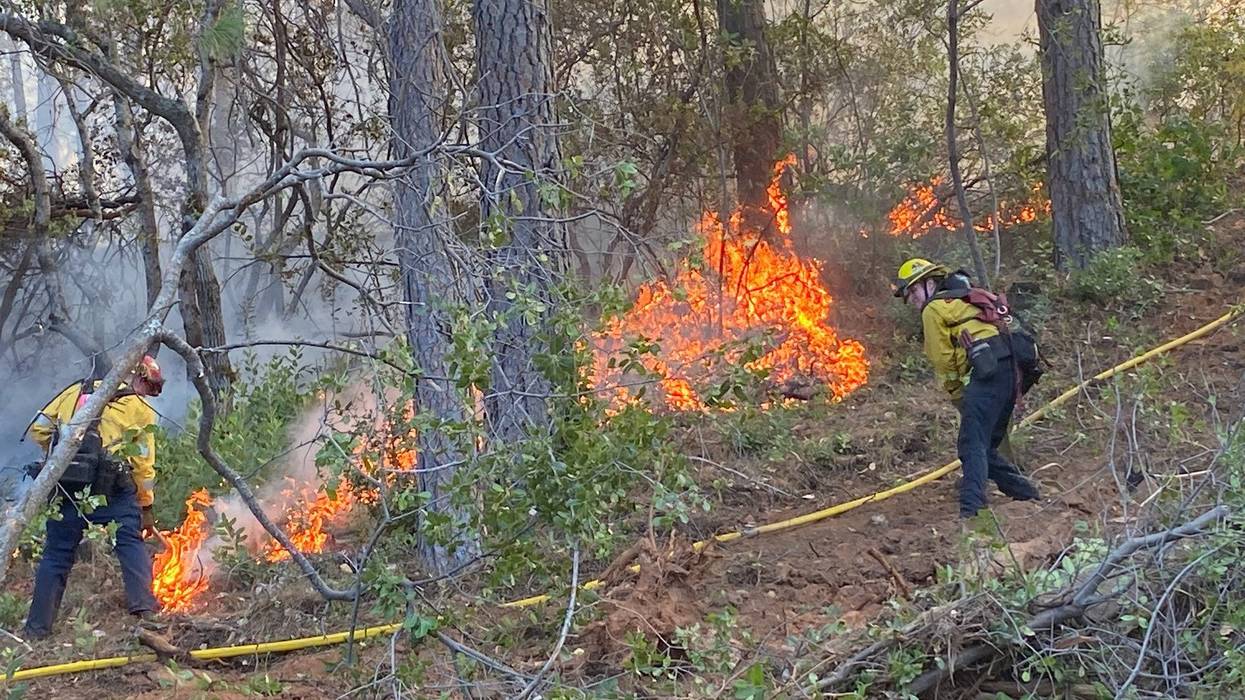 Crews battle the Winding Fire in Yuba County on Monday.