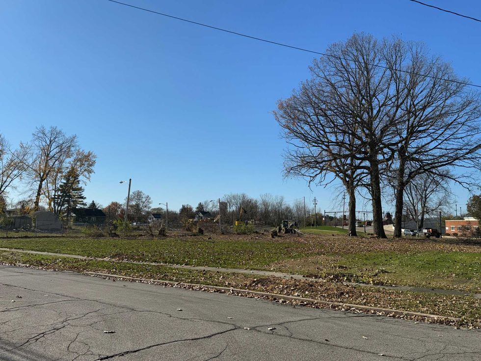 Crews clear out trees and brush between Pearl Street and Front Street located next to Cross Country Mortgage Campus in Berea, Ohio on November 10, 2023. The Haslam Sports Group purchased nearly a dozen lots next to their facility for future expansion and development.