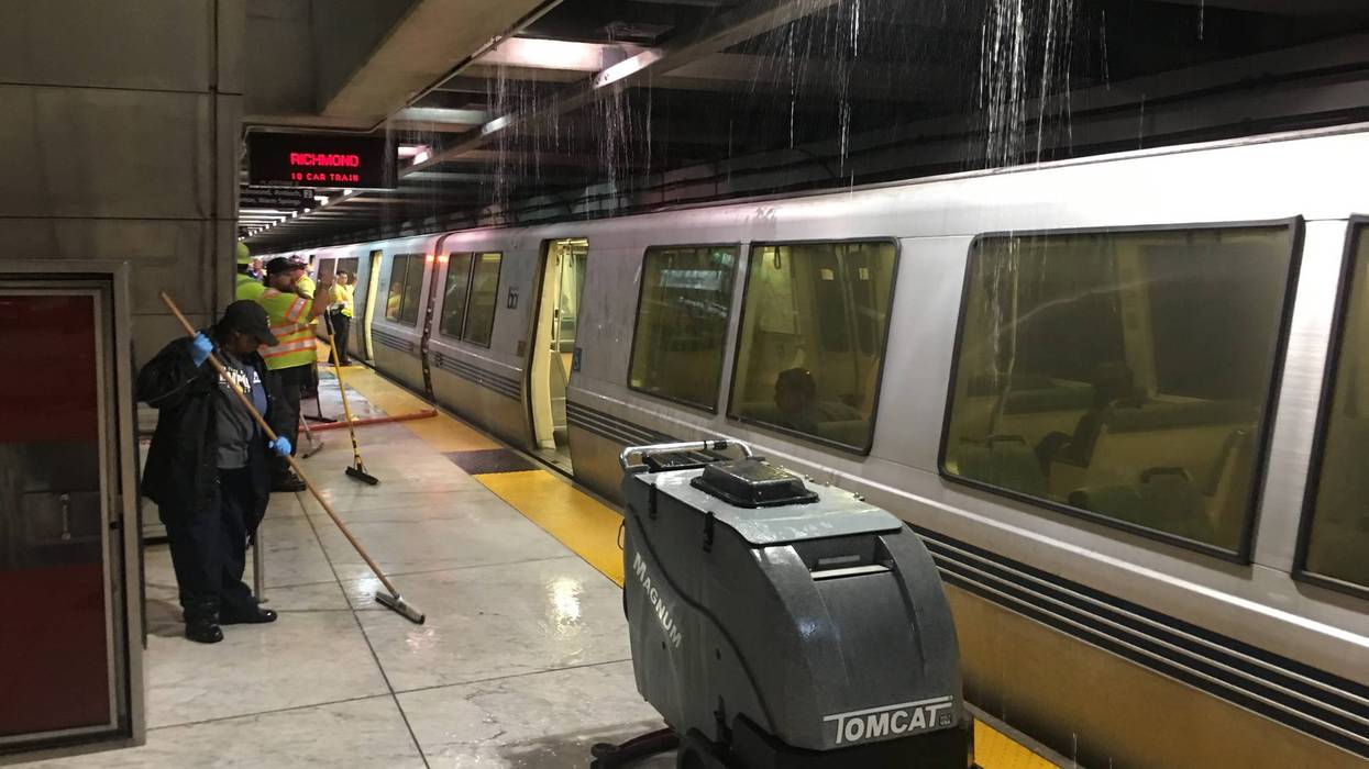 Crews clear water on BART platform at Embarcadero Station July 18, 2019