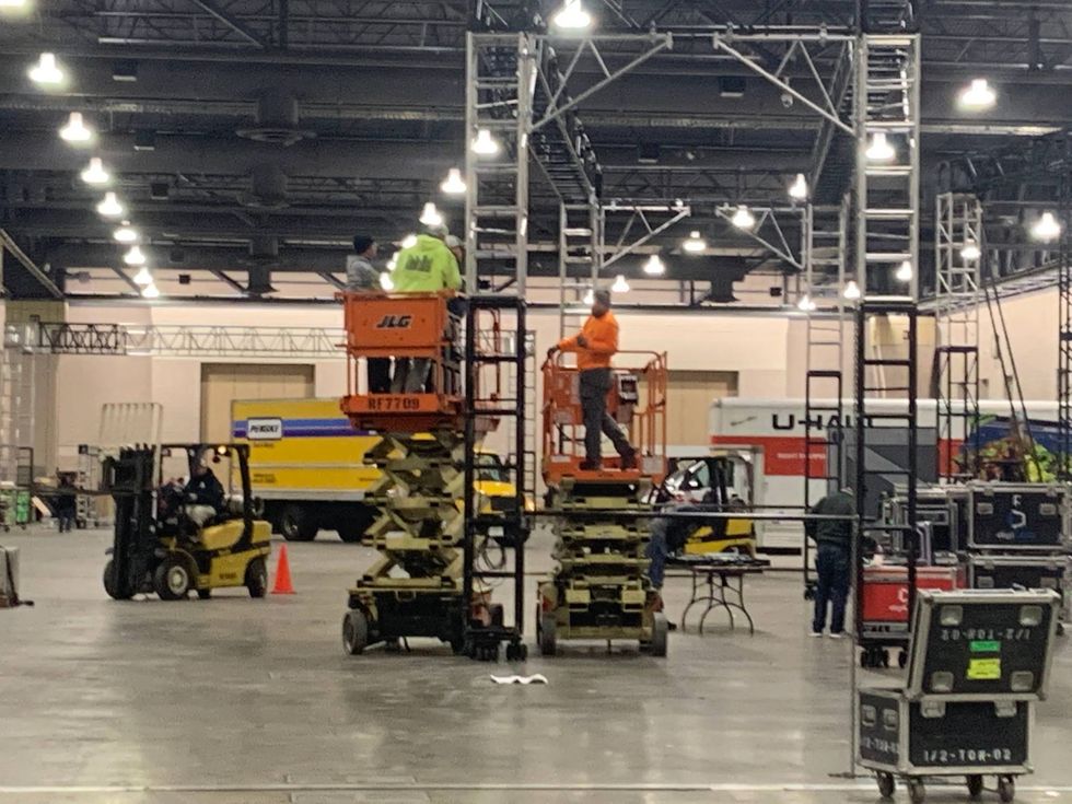 Crews preparing for the Mummers Parade Fancy Brigade Finale inside the Pennsylvania Convention Center.