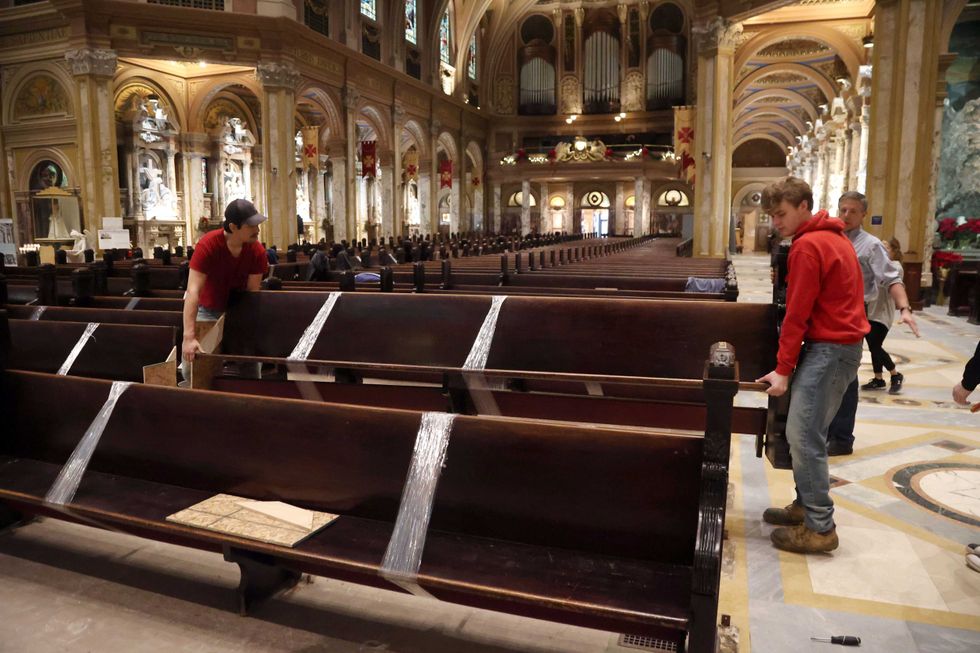 Crews remove pews at OLV