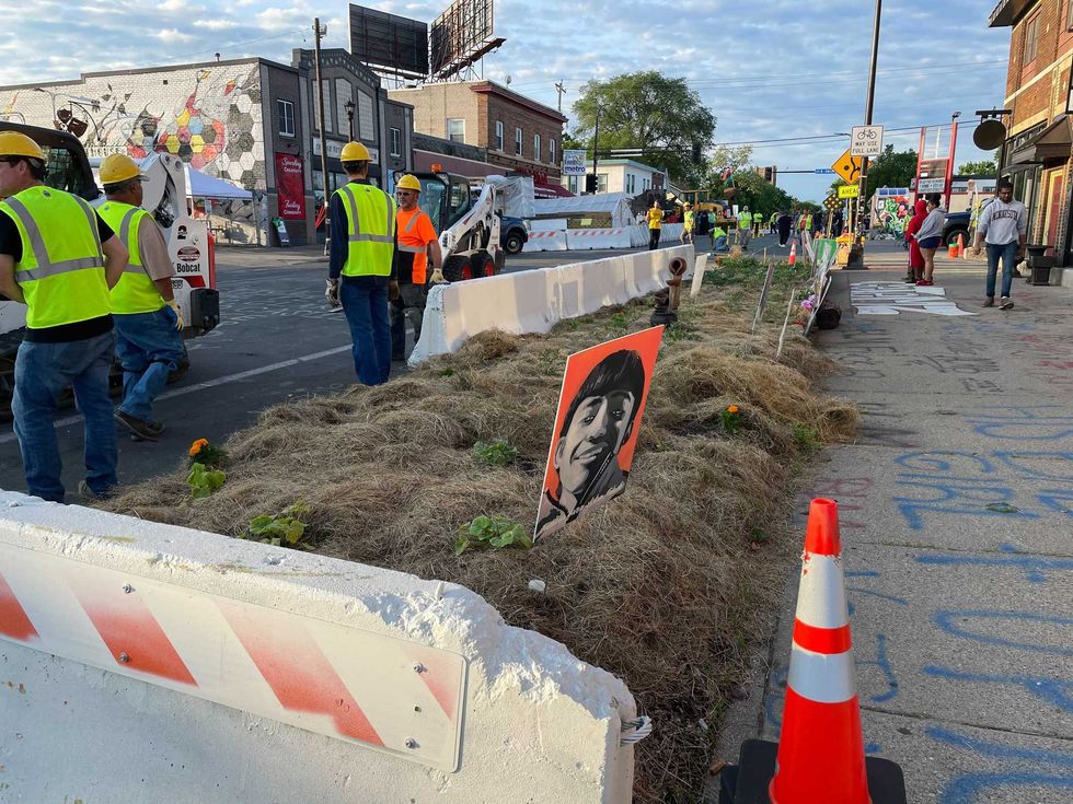 Crews removing barriers from the garden at George Floyd Square