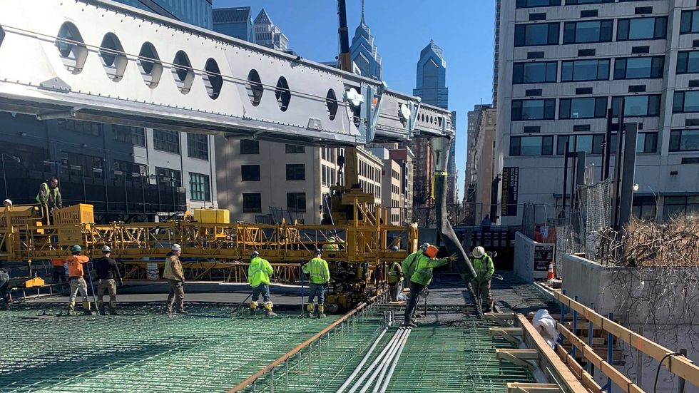 Crews repairing the superstructure of the Chestnut Street Bridge.