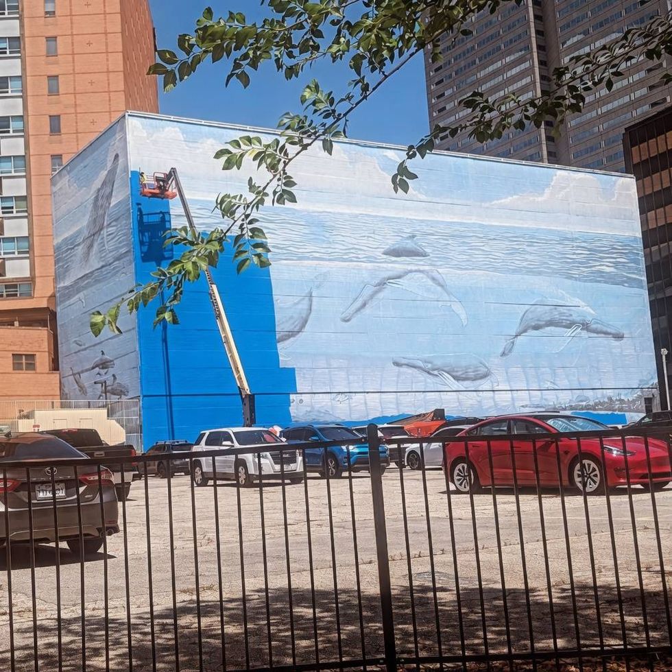 Crews this week began painting over one of downtown Dallas\u2019s most recognizable public artworks, the massive Whaling Wall mural on the side of a parking garage at 505 N. Akard Street.