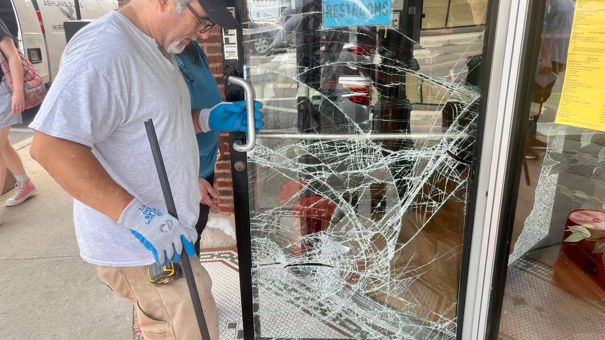 Crews work to repair damaged doors at Modern Grill