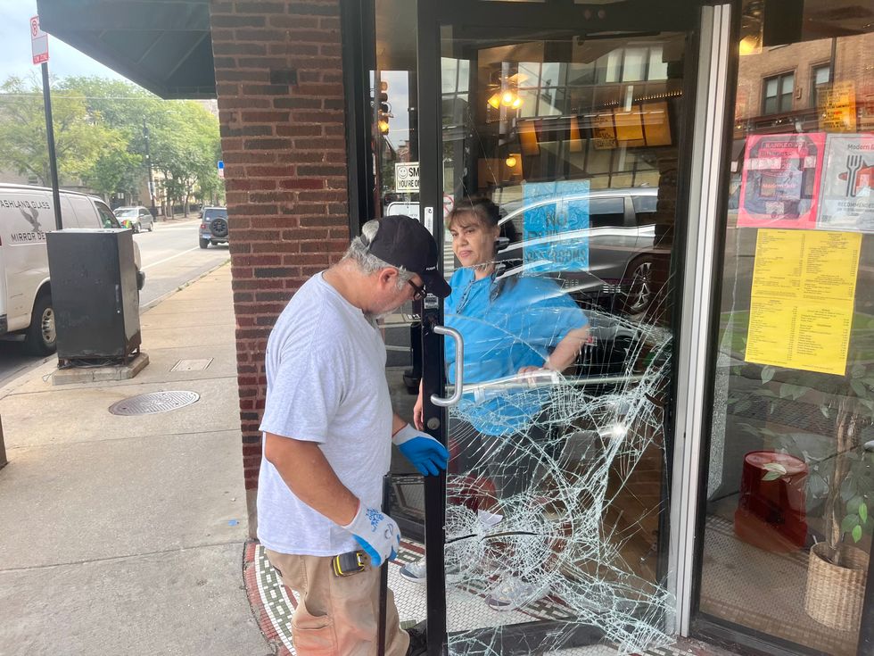 Crews work to repair damaged doors at Modern Grill