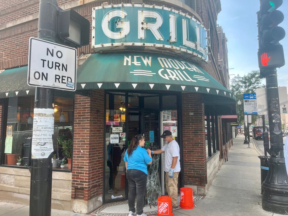 Crews work to repair damaged doors at Modern Grill