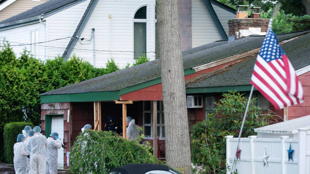 Crime lab officers arrive at the house where a suspect was taken into custody in Massapequa on July 14, 2023
