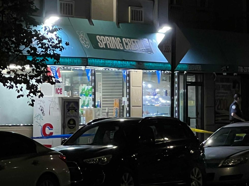 Crime scene tape was up outside the deli, where two men were fatally shot