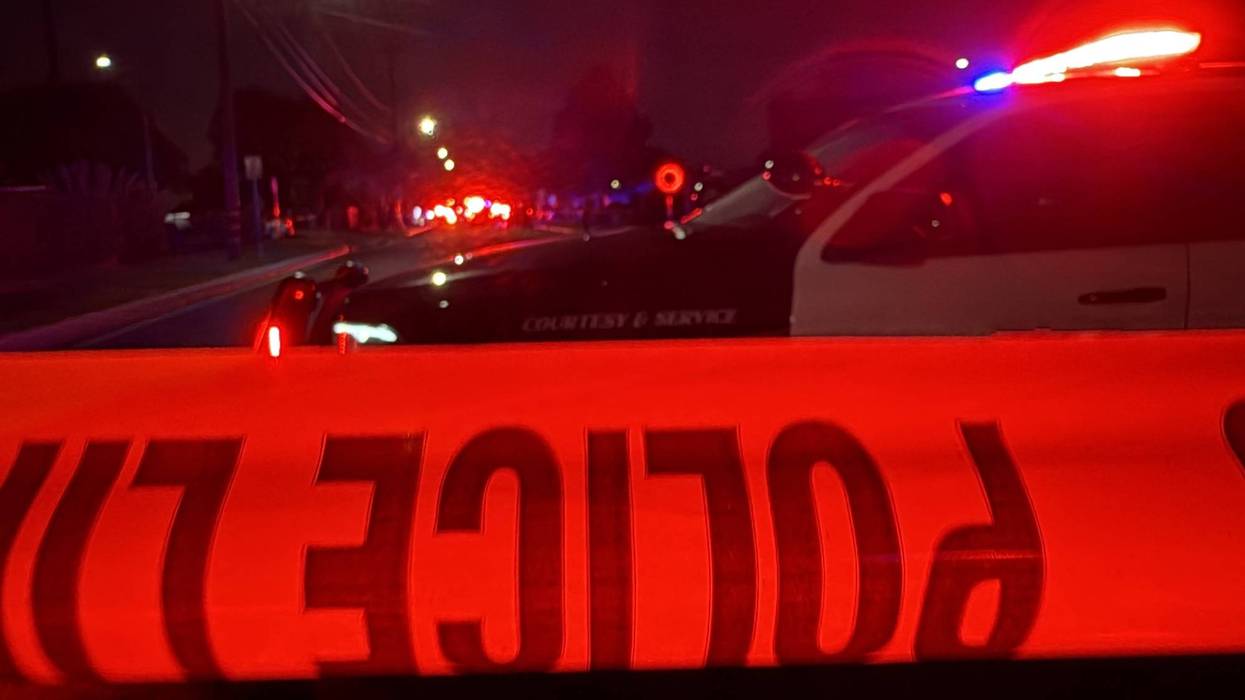 Crime Tape and Police Patrol Car