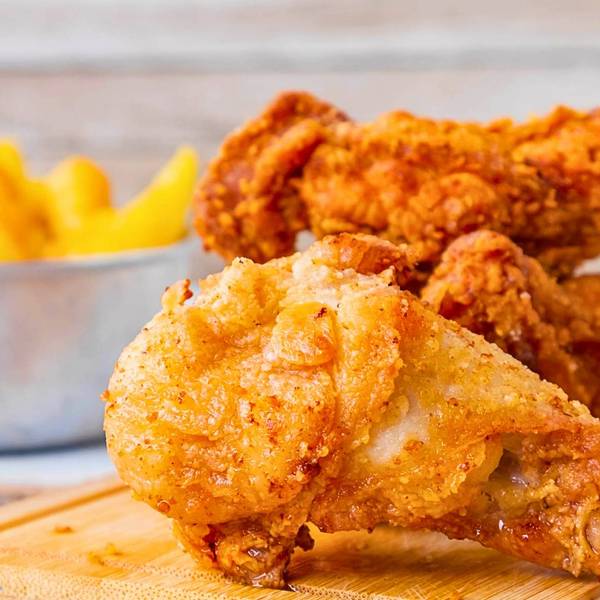 Crispy fried chicken pieces with french fries and ketchup