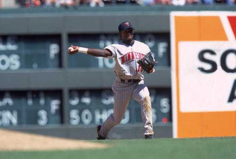 Cristian Guzman #15 of the Minnesota Twins gets ready to throw the ball from the field during the game against the Texas Rangers at The Ball Park in Arlington, Texas. The Twins defeated the Rangers 5-4.