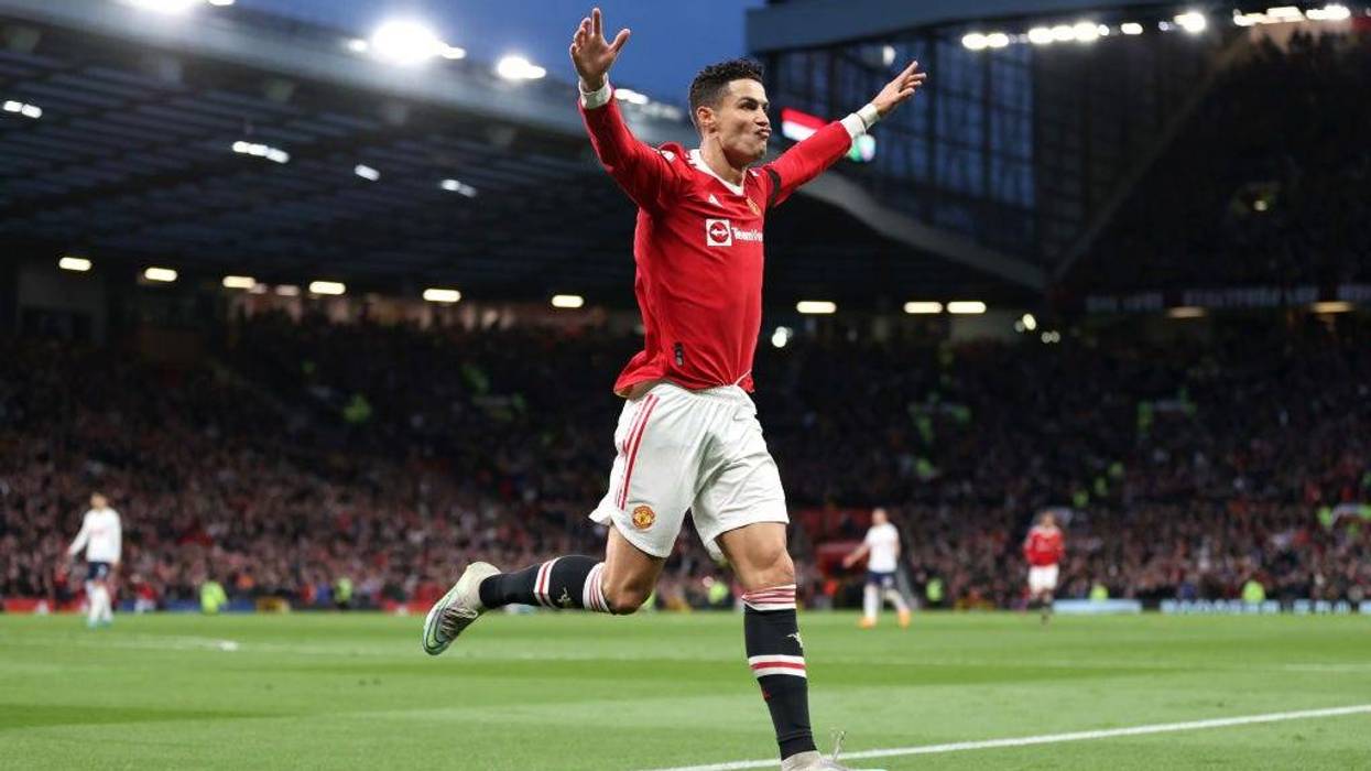 Cristiano Ronaldo of Manchester United celebrates after scoring their side's second goal during the Premier League match between Manchester United and Tottenham Hotspur at Old Trafford on March 12, 2022 in Manchester, England.