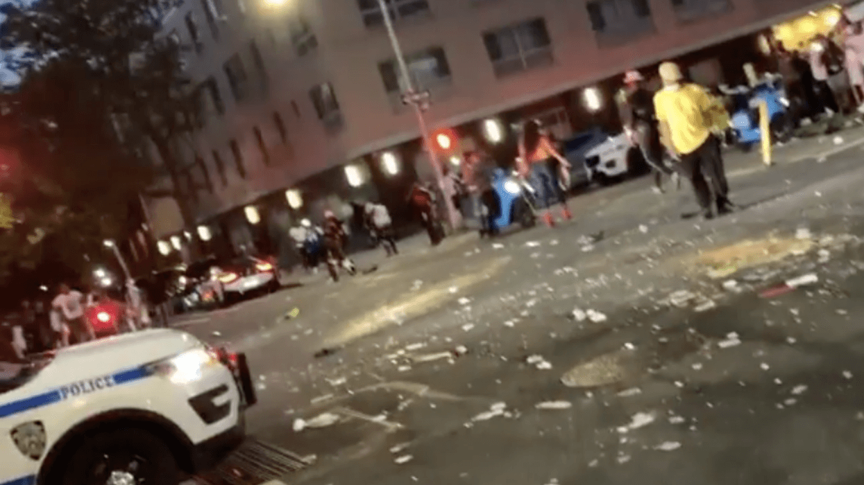 crowd throwing bottles in harlem