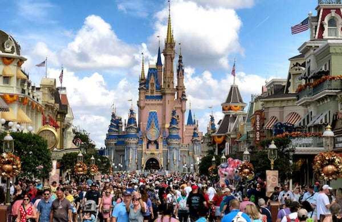 Crowds fill Main Street USA in front of Cinderella Castle at the Magic Kingdom