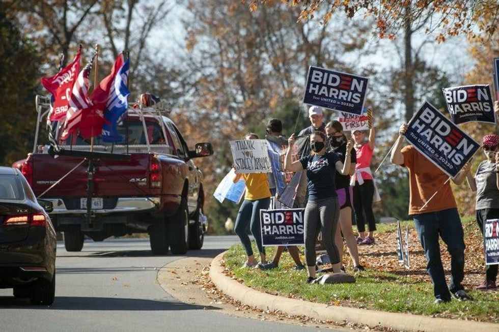 Crowds gather outside the Trump National Golf Club in Sterling, Virginia, when President Donald Trump was seen golfing on Nov. 7, 2020. Photo credit Jack Gruber-USA TODAY