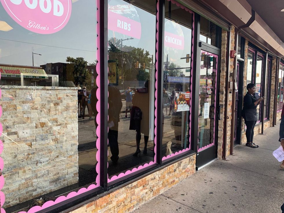Crystal Bradley outside storefront refurbished from City of Philadelphia-funded initiatives.