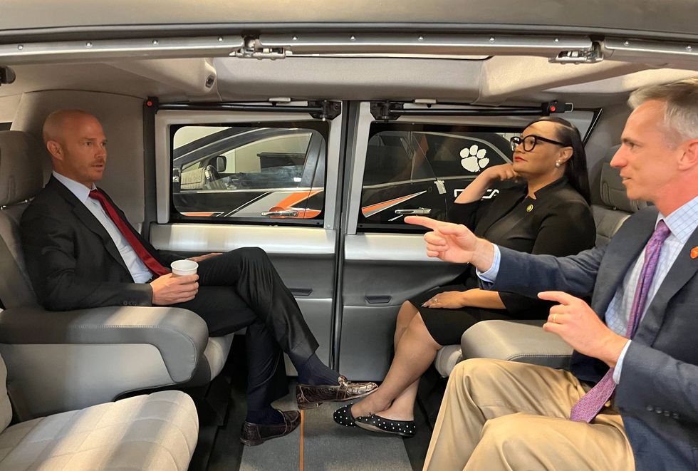 CU-ICAR Executive Director David Clayton introduces Congressman Timmons and Congresswoman Williams to a prototype autonomous vehicle at an ICAR facility