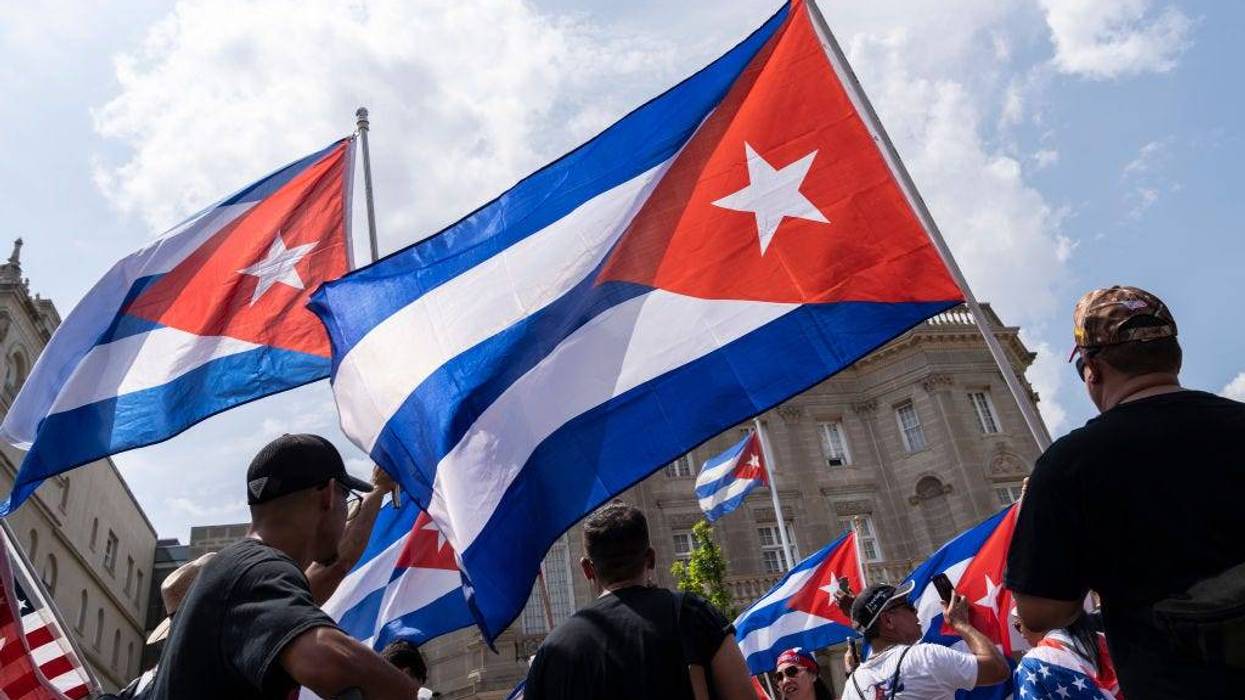 Cuban activists and supporters rally outside the Cuban Embassy during a Cuban freedom rally on July 26, 2021 in Washington, DC. Cuban activists and demonstrators held a rally to urge the American government to intervene in Cuba to support human rights and end Communism in Cuba.