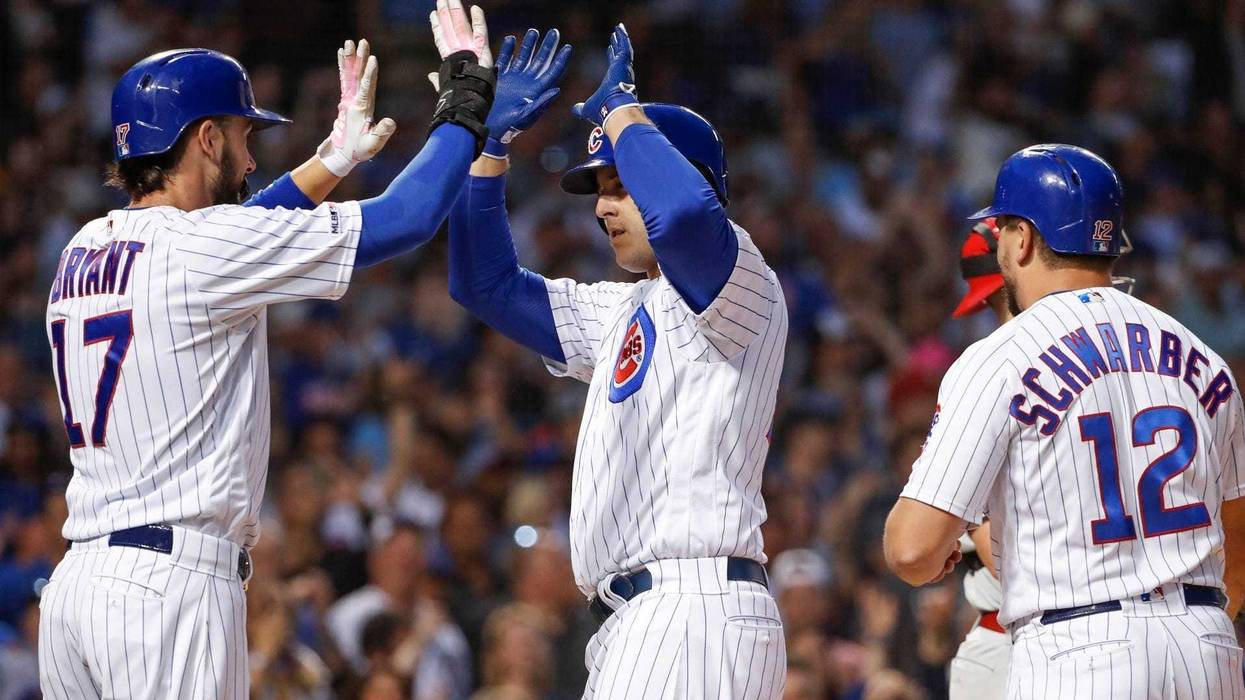 Cubs first baseman Anthony Rizzo (44) celebrates with third baseman Kris Bryant (17) after hitting a homer.