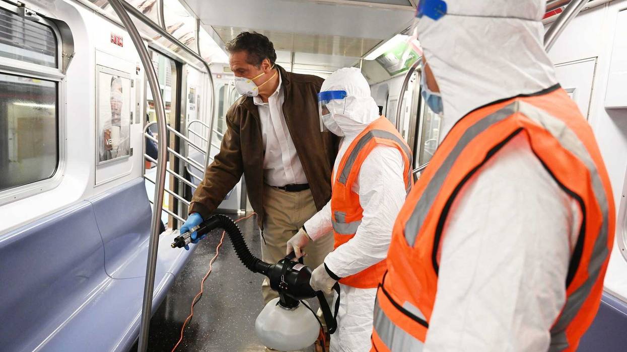 Cuomo disinfects a 7 train car in Queens