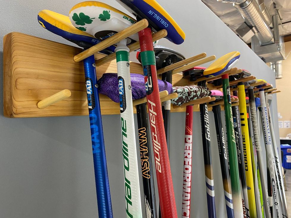 Curling brooms waiting for the next match.