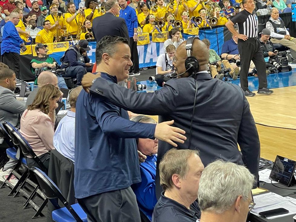 Curtis Aiken hugging Sean Miller