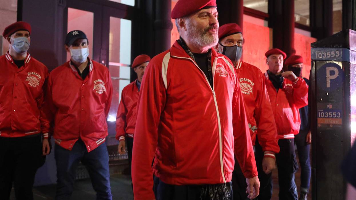 Curtis Sliwa, the founder and CEO of the Guardian Angels, walks with other Guardian Angels on a safety patrol in lower Manhattan