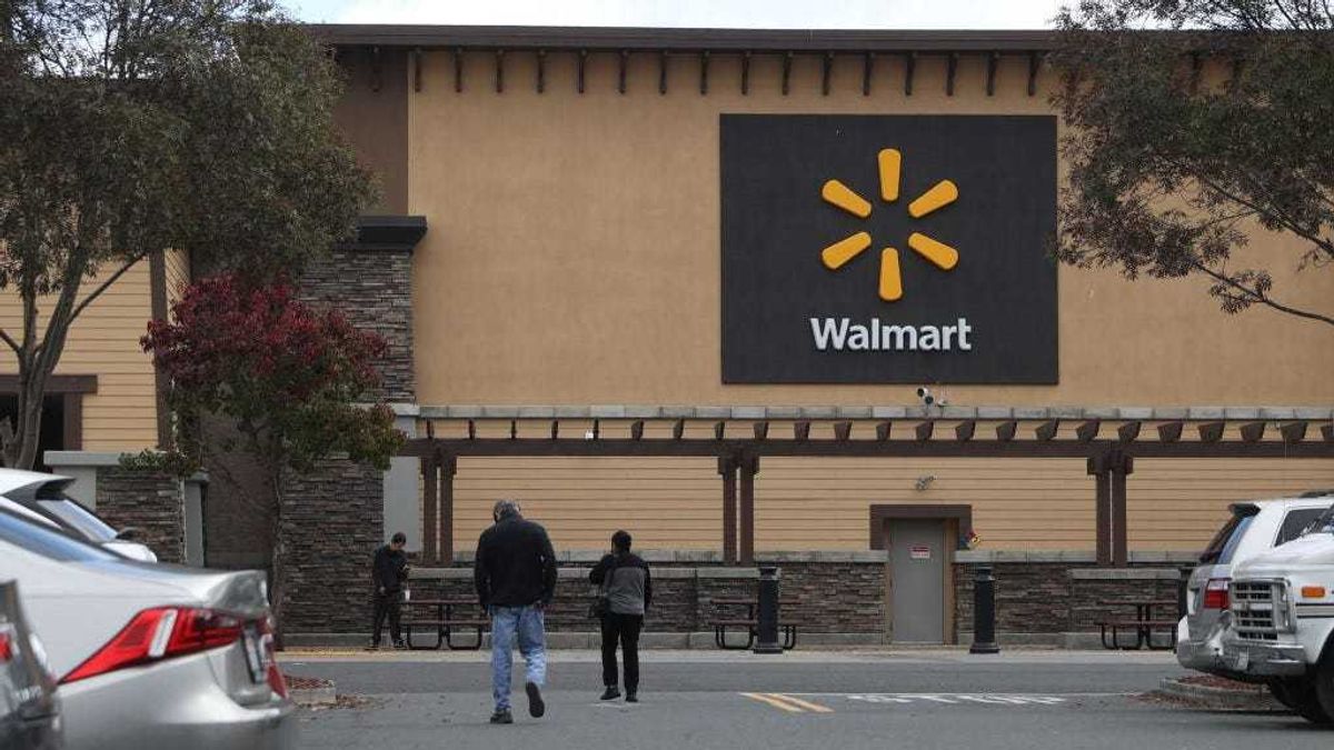 Customers enter a Walmart store on November 16, 2021 in American Canyon, California.