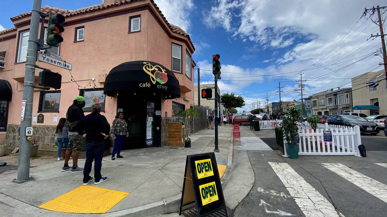 Customers line up at Cafe Envy on the first day San Francisco restaurants were allowed to reopen for outdoor dining.