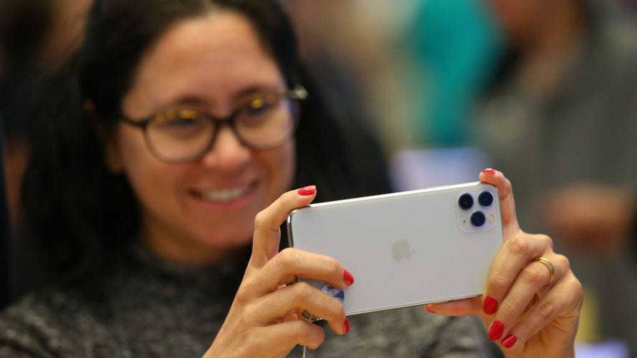 Customers look at iPhone models at Apple Store on September 20, 2019 in Sydney, Australia.