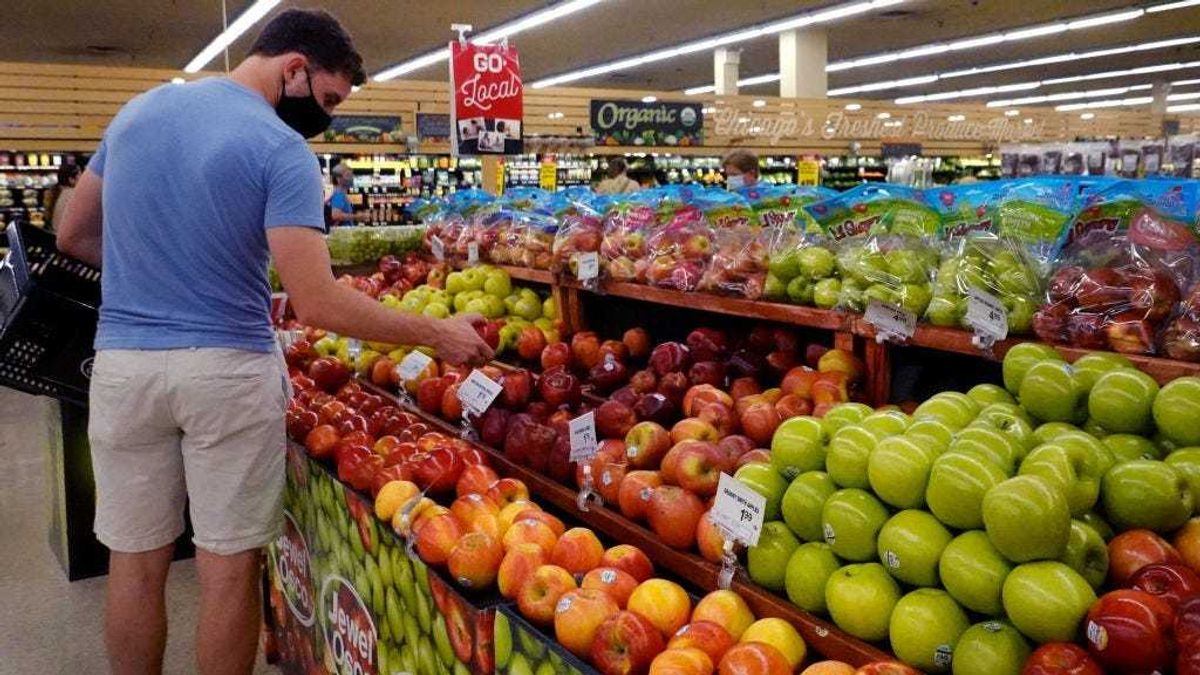 Customers shop for produce at a supermarket on June 10, 2021 in Chicago, Illinois.