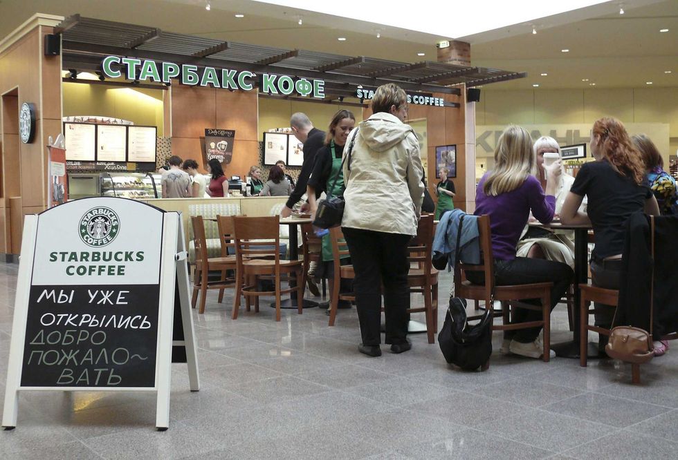 Customers sit in Russia