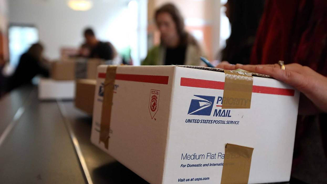 Customers wait in line at a post office in Rincon Center in San Francisco.