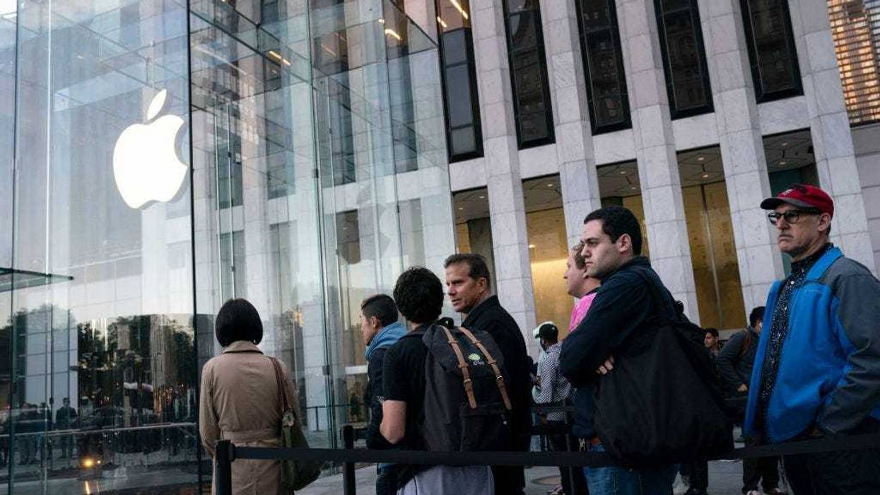 Customers wait in line to purchase the new iPhone 11 at Apple's flagship 5th Avenue store on September 20, 2019 in New York City. Apple's new iPhone 11 goes on sale today at the grand re-opening of the 5th Avenue store. (Photo by Drew Angerer/Getty Images)