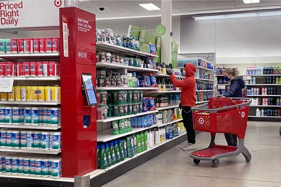 Customers wear face masks in a Target store