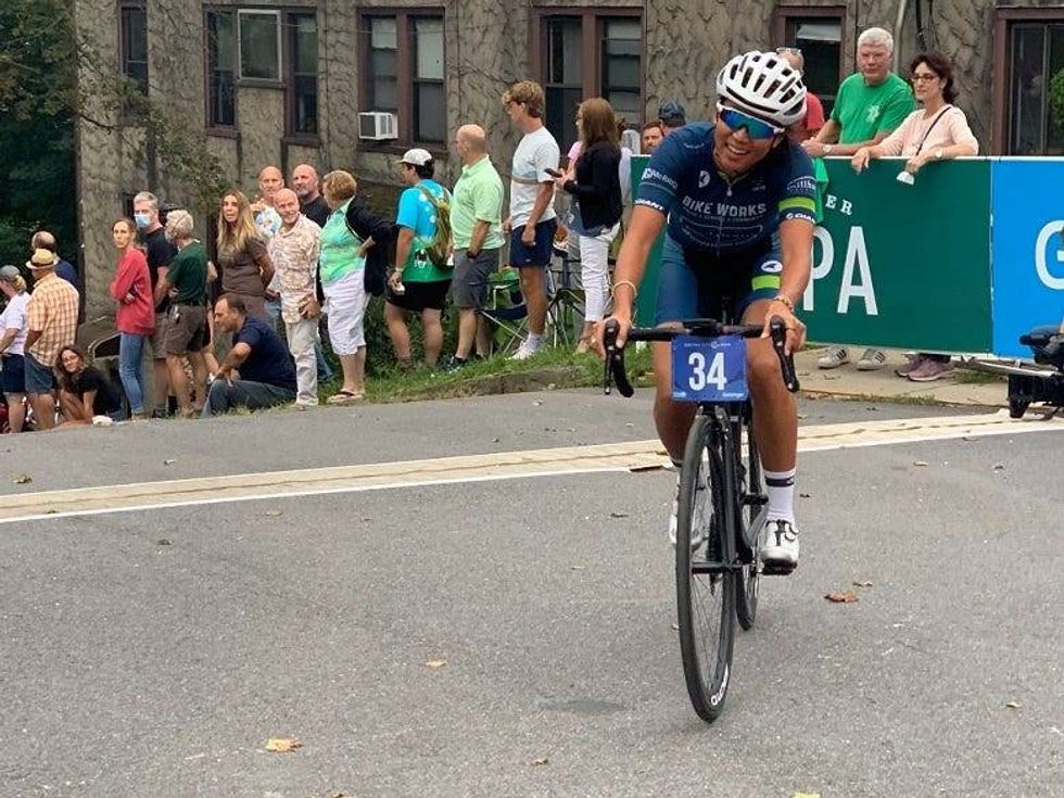 cyclist crossing finish line