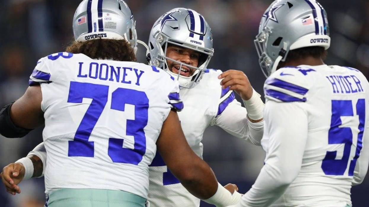 Dak Prescott and Joe Looney hug before Dallas Cowboys game