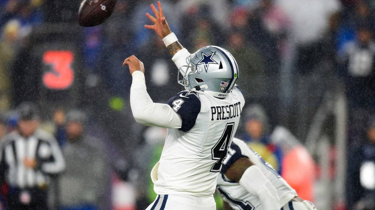 Dak Prescott mishandles a snap against the Patriots.