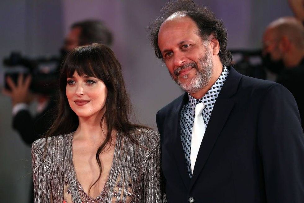 Dakota Johnson (left) and Luca Guadagnino (right) at the 2021 Venice International Film Festival