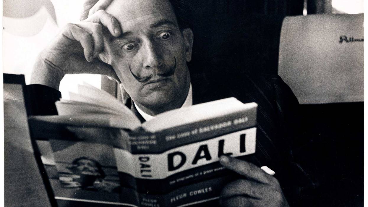 Dali reading his biography
