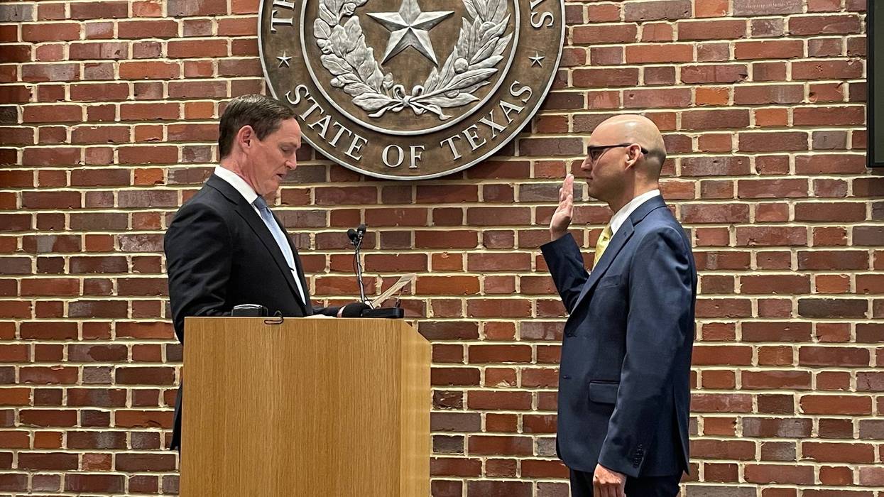 Dallas County Judge Clay Lewis Jenkins swears in Paul Adams as Dallas County Elections Administrator